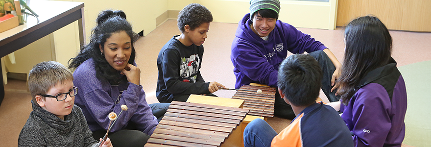 Current students teaching children music